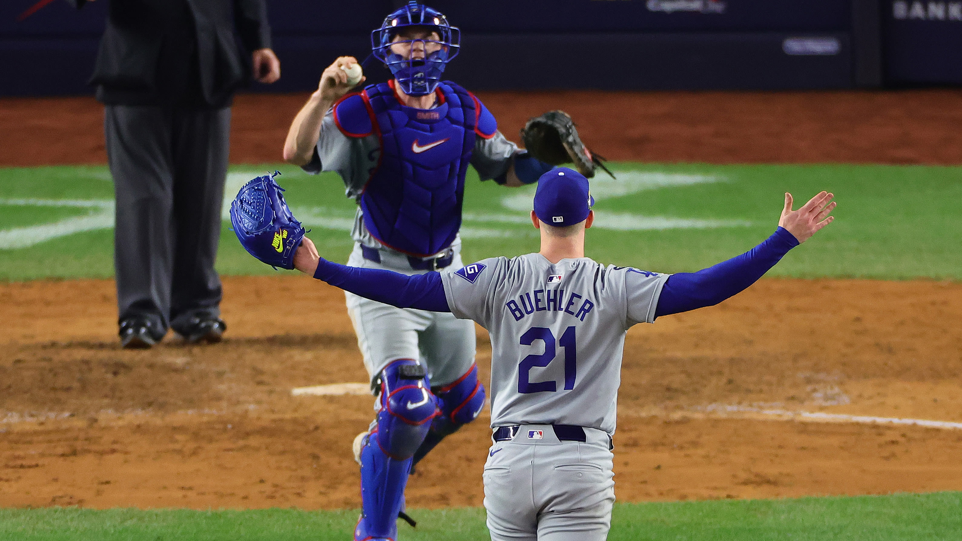 Will Smith and Walker Buehler celebrate the final out of the 2024 World Series