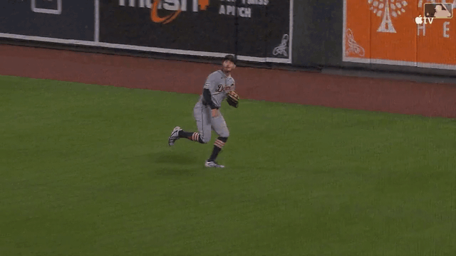 An animated gif of Zach McKinstry making a diving catch