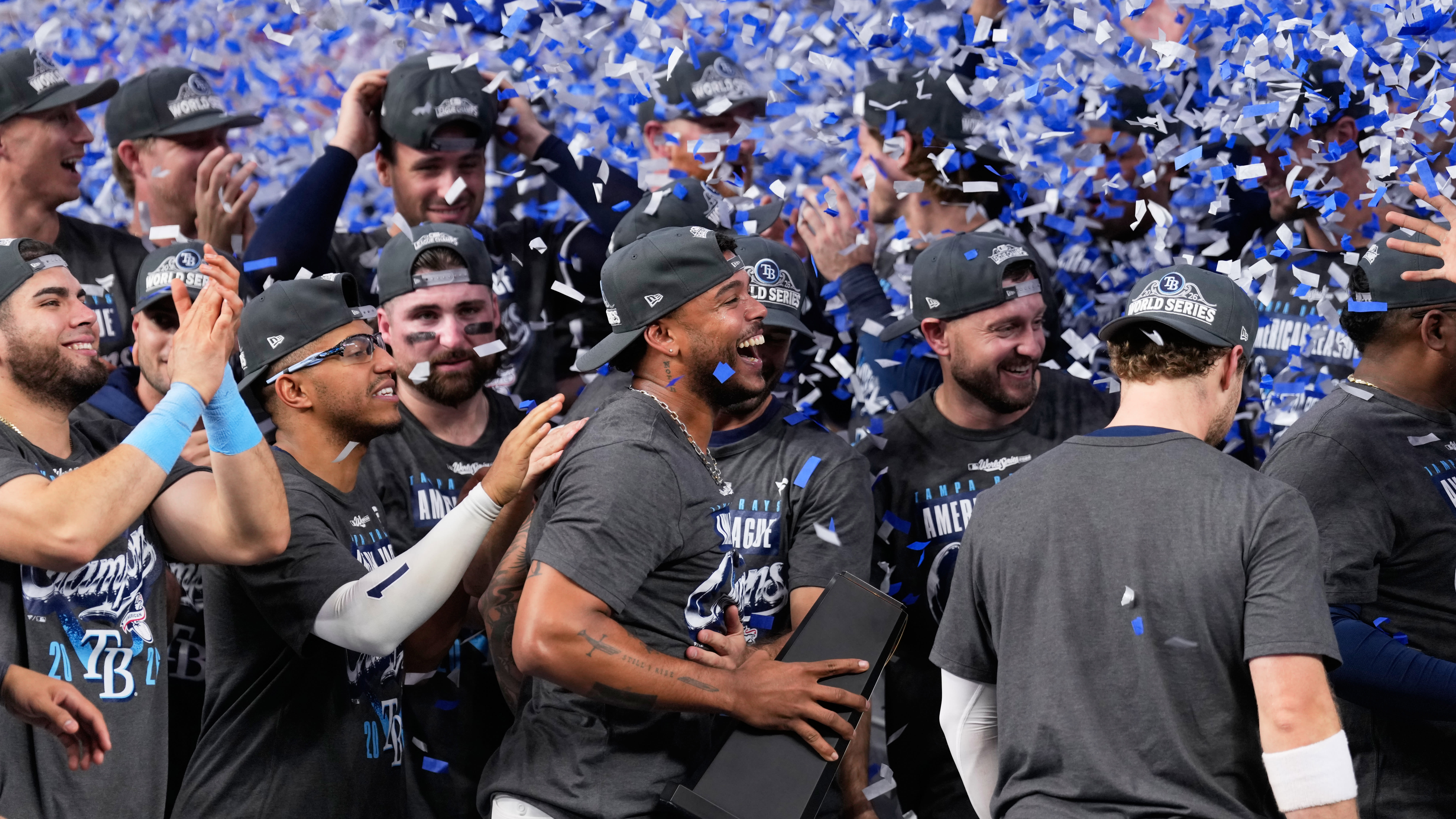 Confetti falls on the Rays as they celebrate on the field