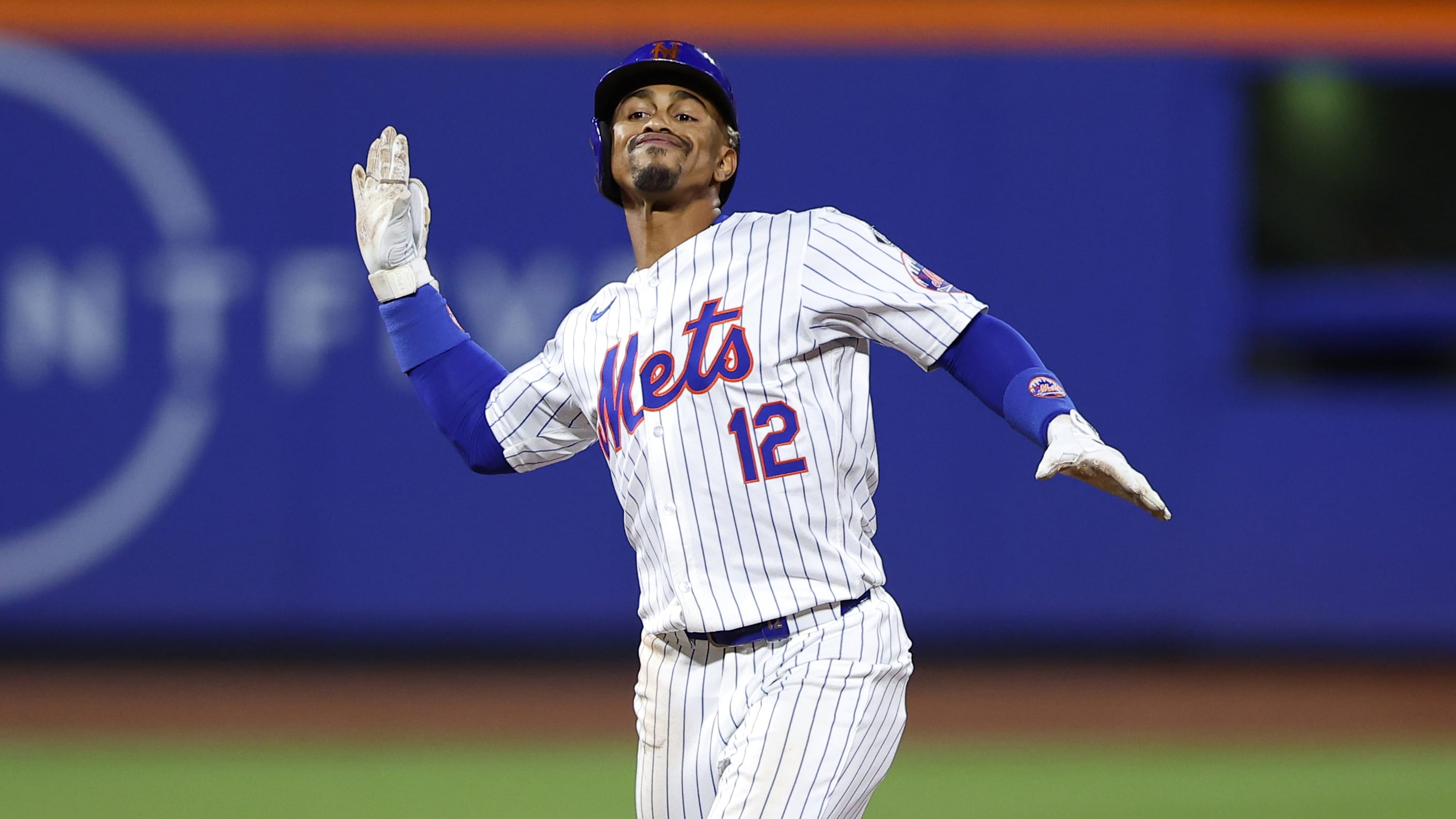 Francisco Lindor celebrates on the basepaths after recording an RBI knock