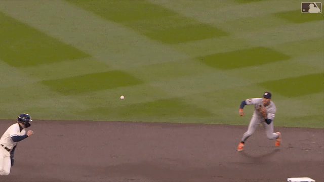 An animated gif of Jeremy Peña catching a line drive and diving to tag out a baserunner