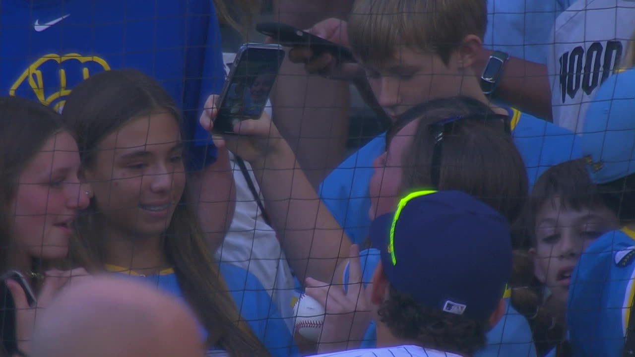 Willy Adames takes a selfie with a fan