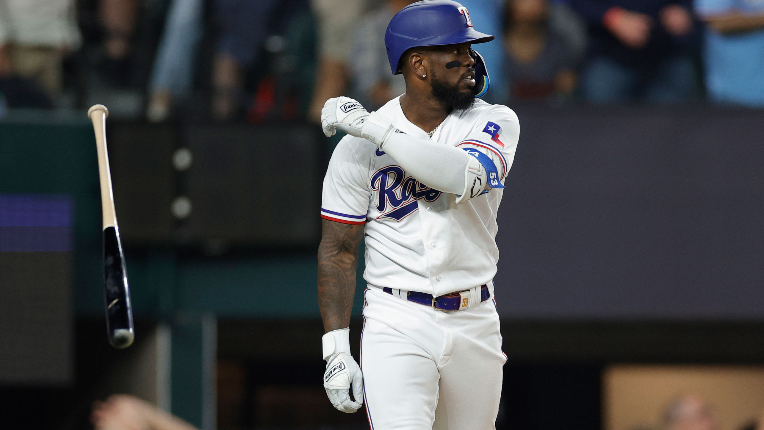 Adolis García tosses his bat away after hitting a home run