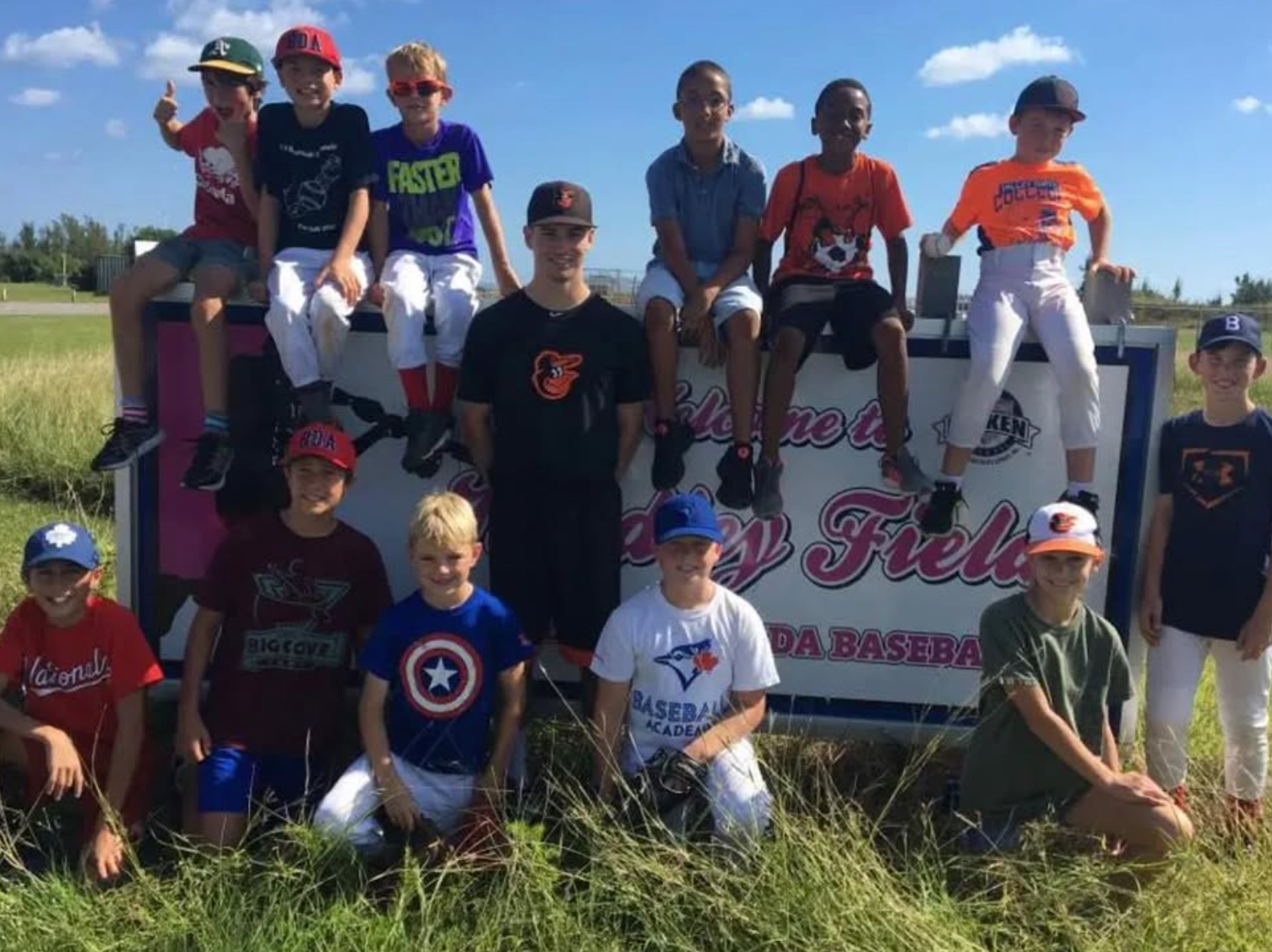 Adam Hall (center) at Kindley Field