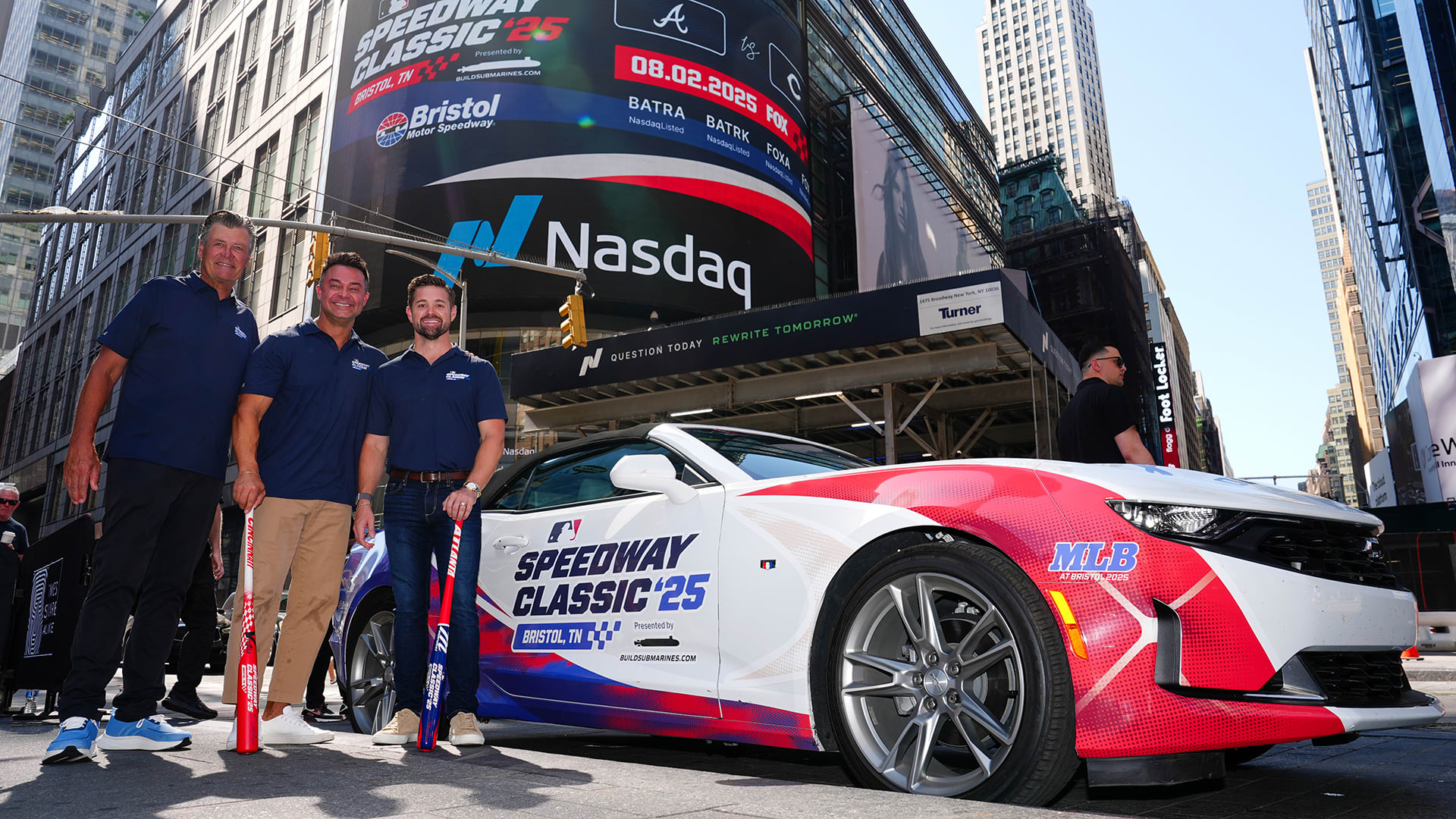 Michael Waltrip, Nick Swisher and Ricky Stenhouse Jr. pose in front of a race car