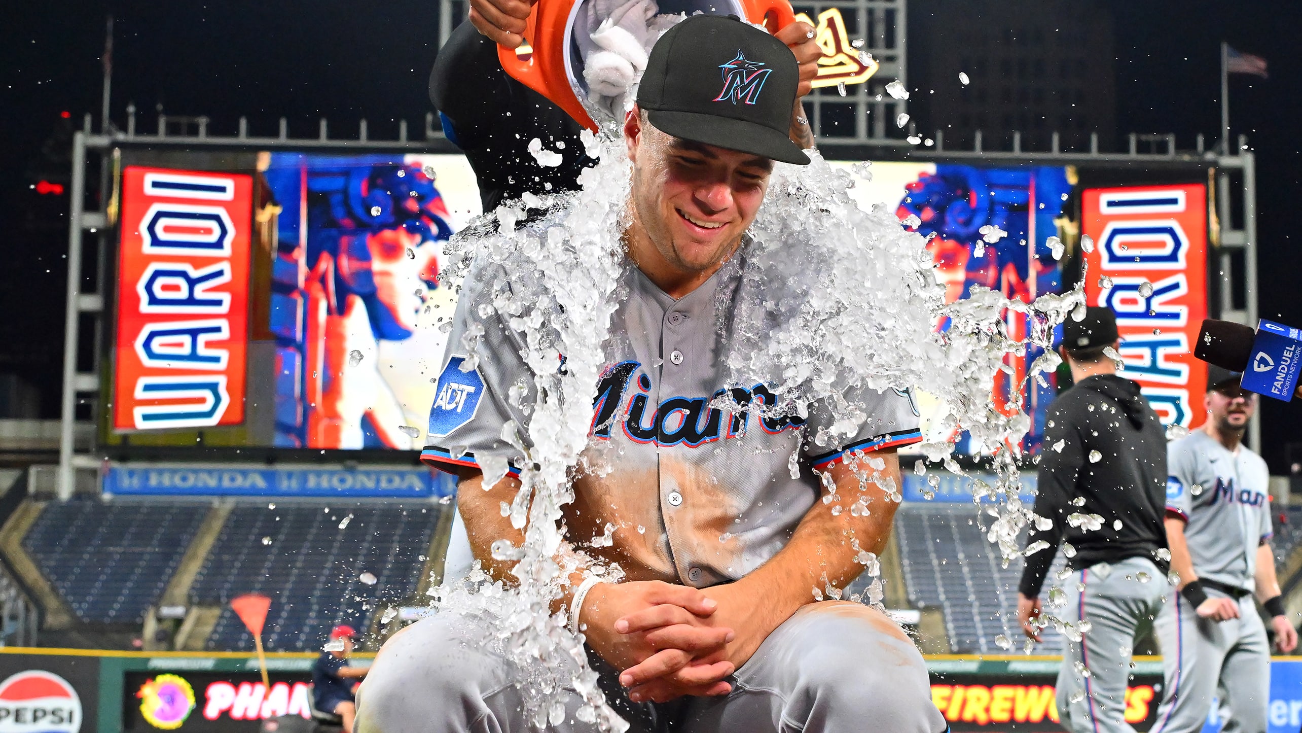 The Marlins' Jakob Marsee is doused during a postgame interview