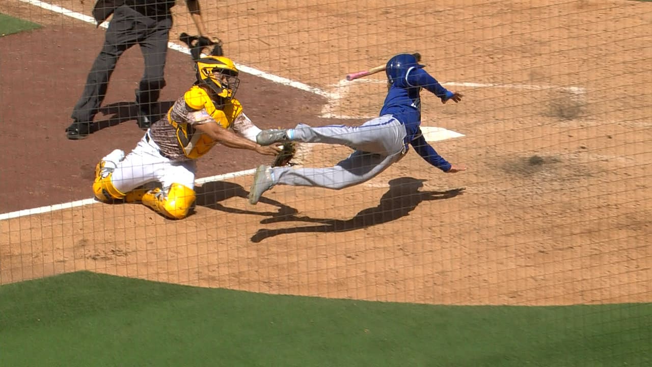A screengrab of Drew Waters leaping past a tag at home plate