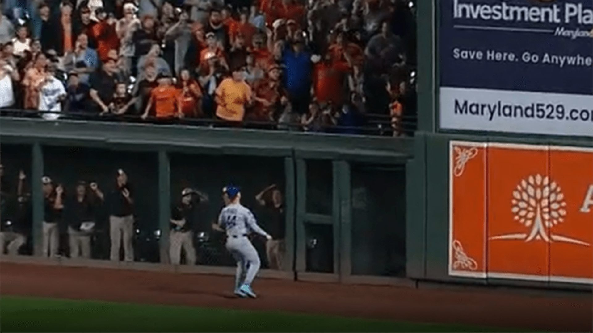 Andy Pages watches a Jackson Holliday home run sail over his head