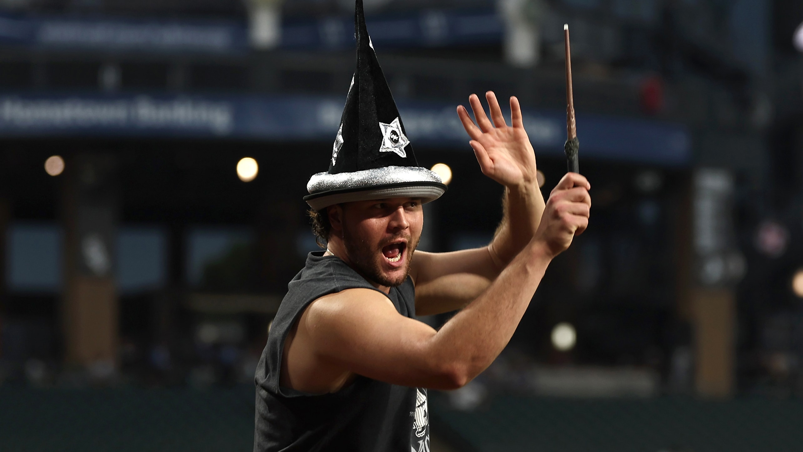 Mike Vasil wearing a wizard hat and waving a magic wand