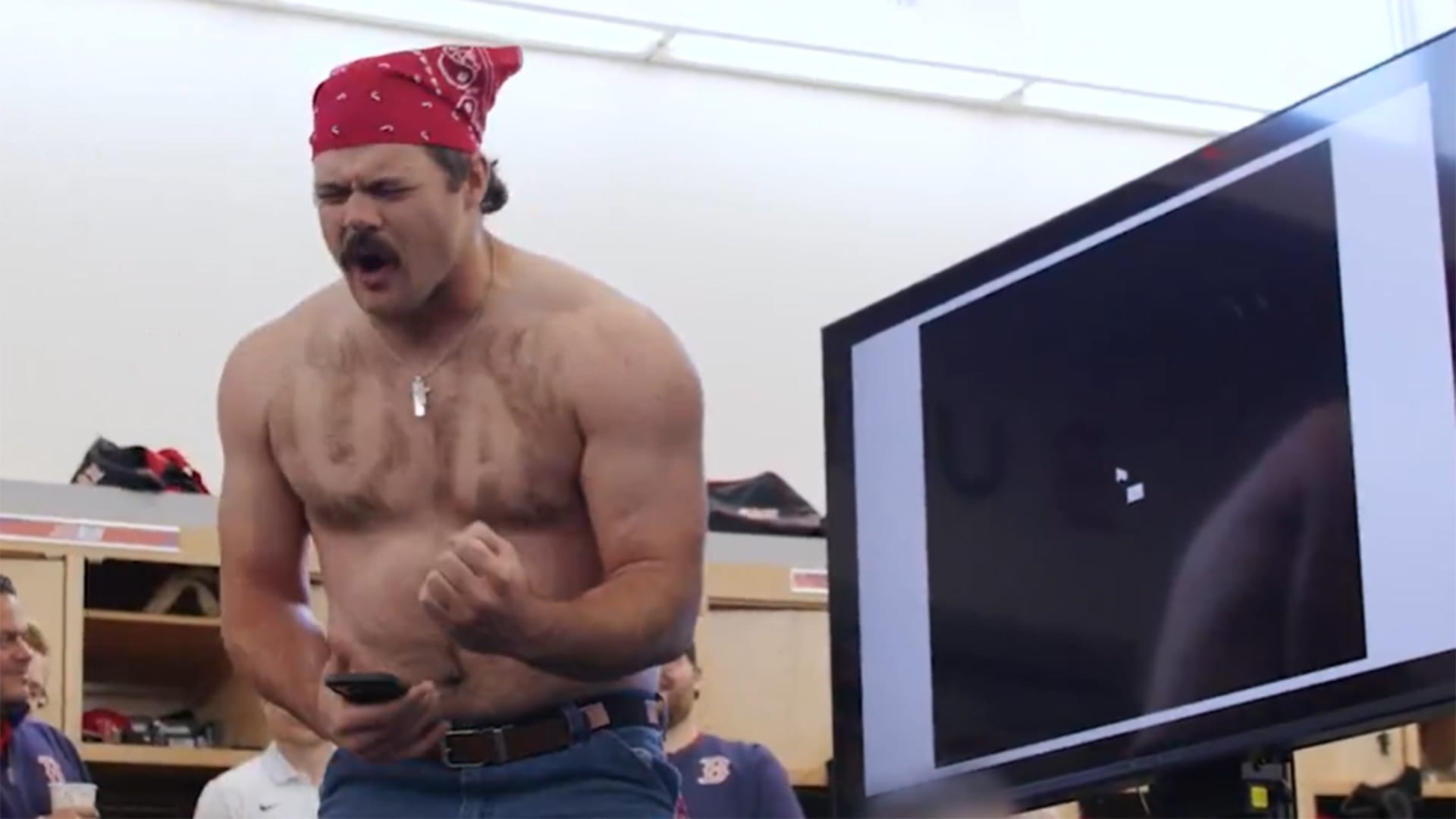 Red Sox prospect Payton Tolle with USA shaved into his chest hair giving an impassioned speech