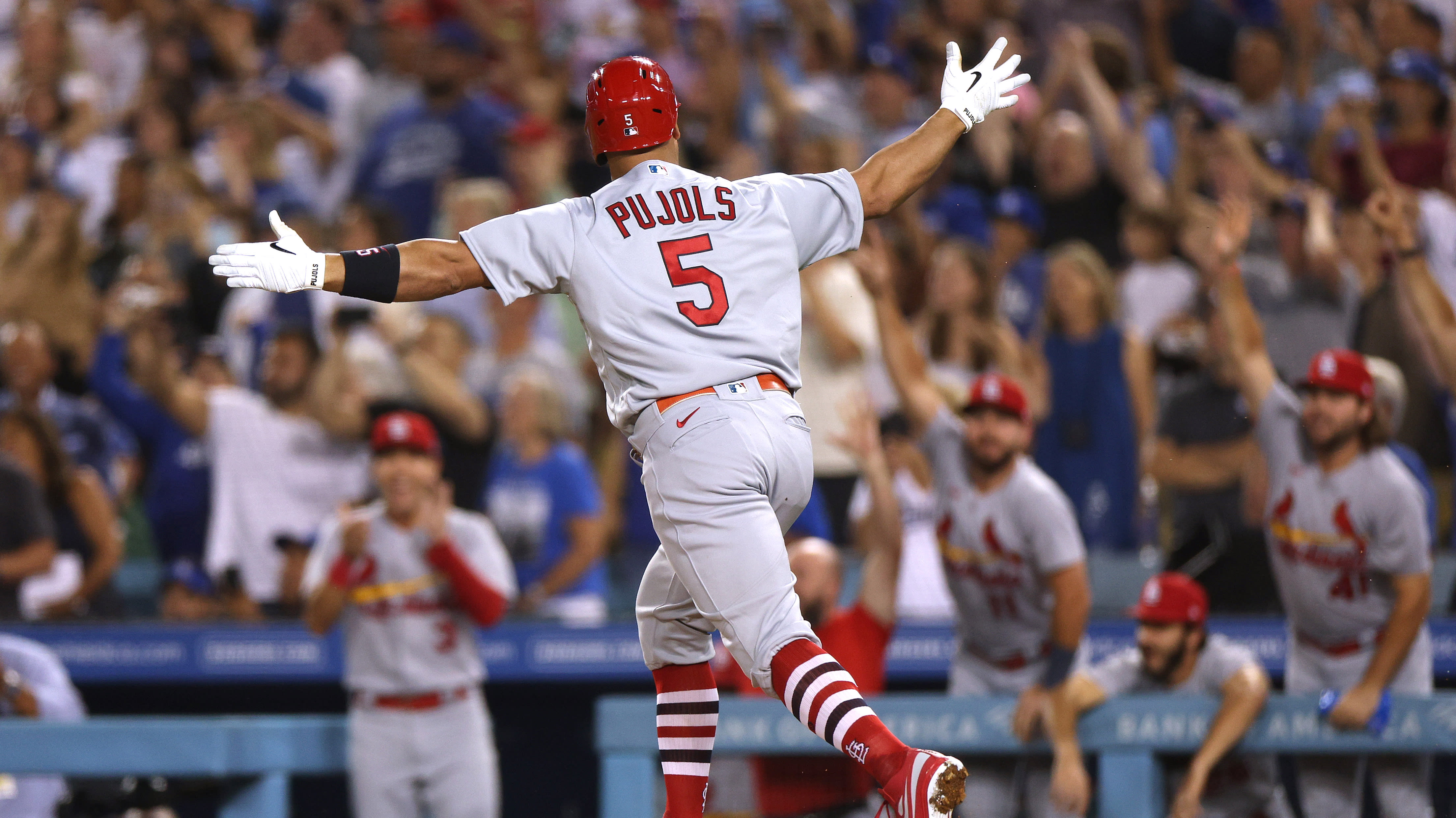 Albert Pujols celebrates his 700th home run