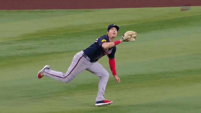 An animated gif of Mike Yastrzemski making a diving catch