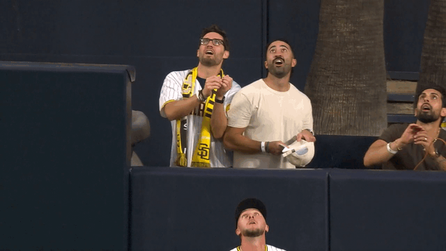 An animated gif of Jackson Merrill leaping to rob a home run in front of fans
