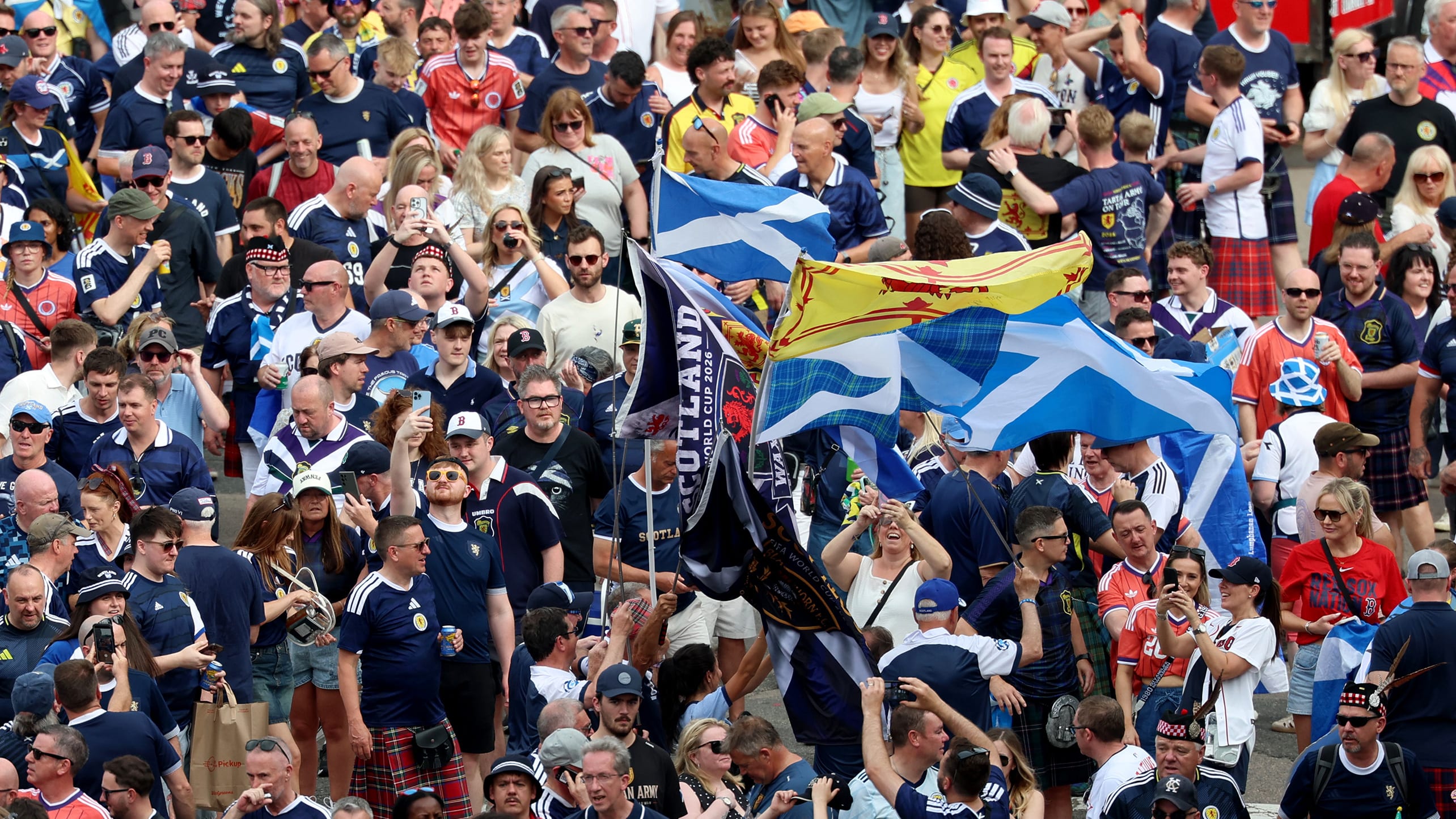 Scotland soccer fans take part in the Tartan Army March, making their way to Fenway Park