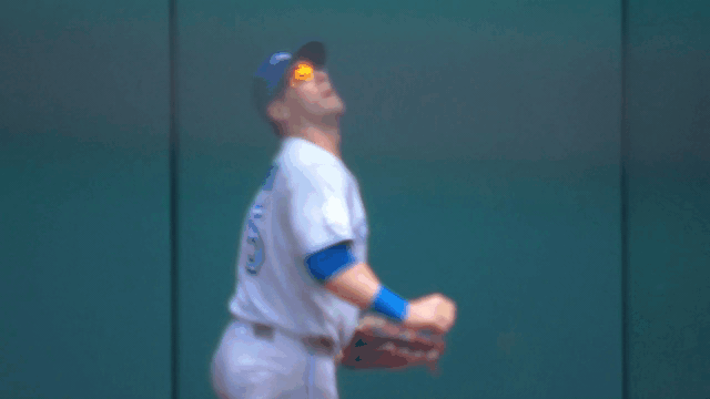 An animated GIF of Daulton Varsho robbing a home run