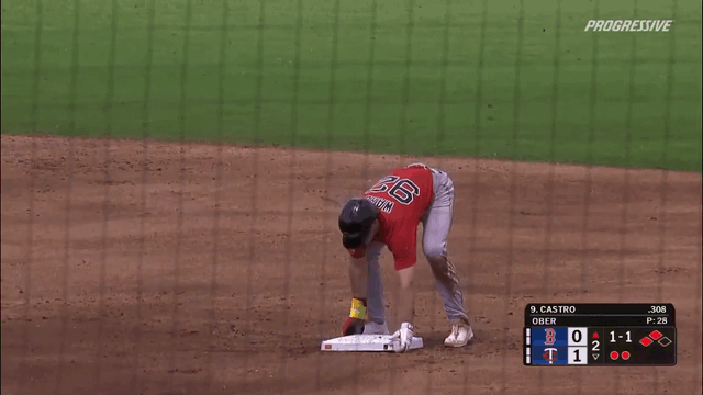 An animated gif of Red Sox player Braiden Ward pulling a base out of the ground