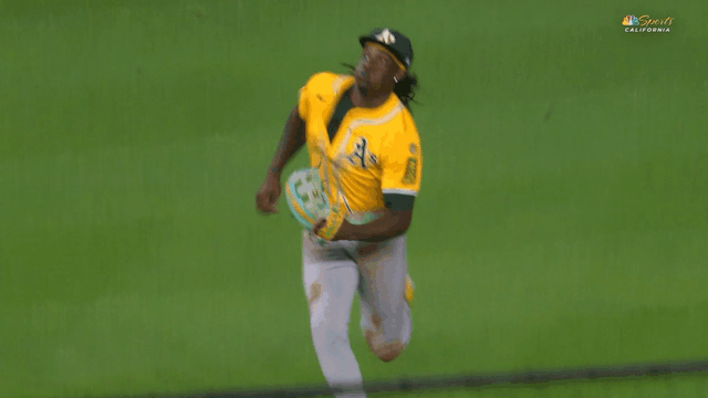 An animated gif of Lawrence Butler making a sliding catch