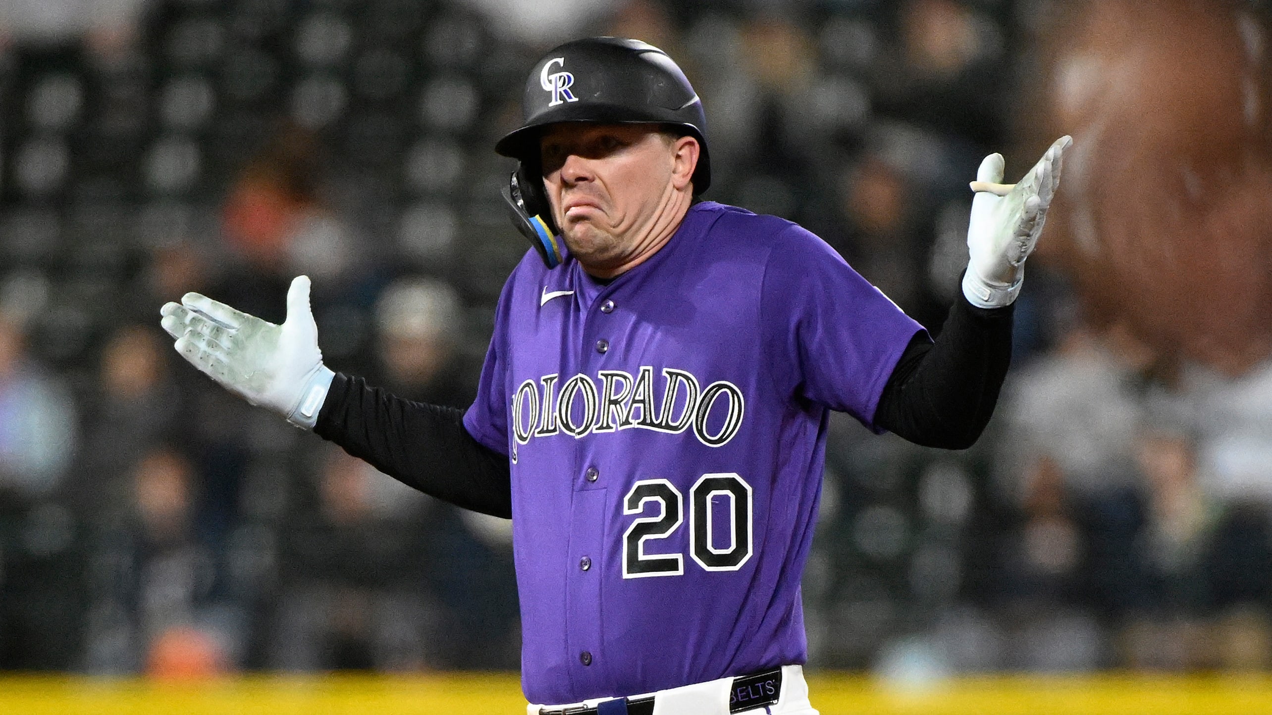 The Rockies' Troy Johnston shrugging on base