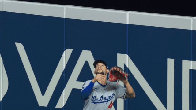 An animated gif of Andy Pages making a leaping catch