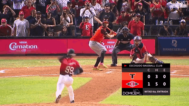 An animated gif of Jefry Yan leaping and pounding his chest to celebrate a strikeout