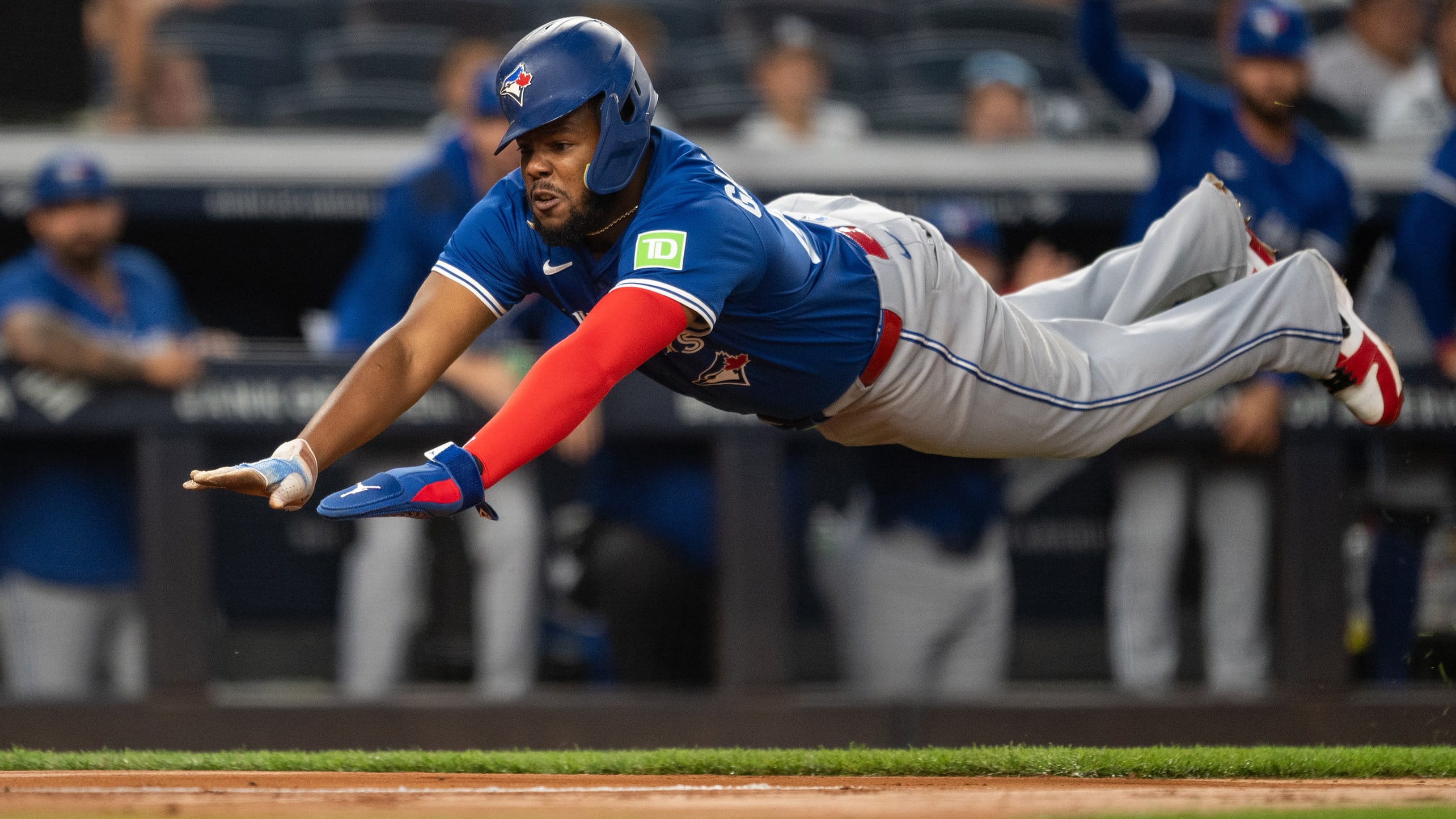 Vladimir Guerrero Jr. dives into home plate