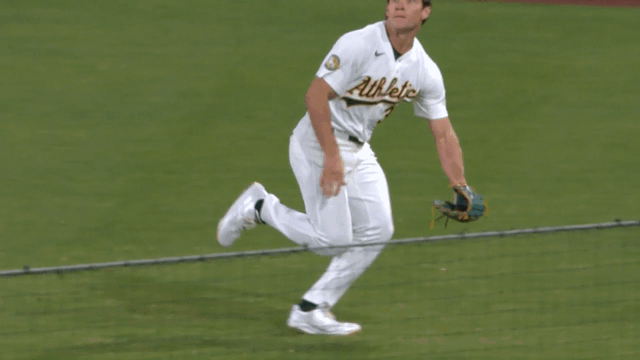 An animated gif of A's right fielder Colby Thomas making a diving catch