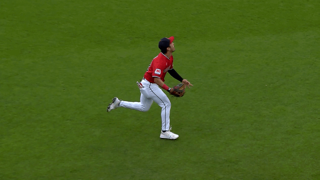An animated gif of Steven Kwan making a diving catch
