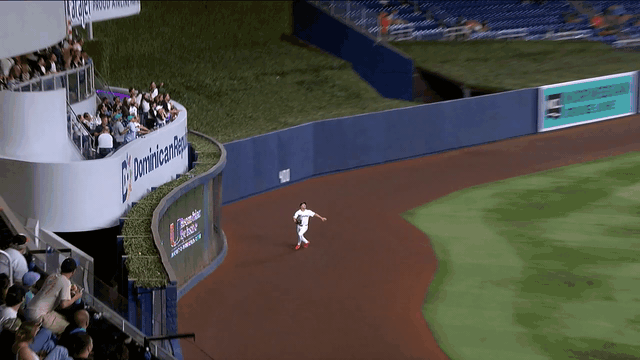Jakob Marsee makes a leaping catch at the wall
