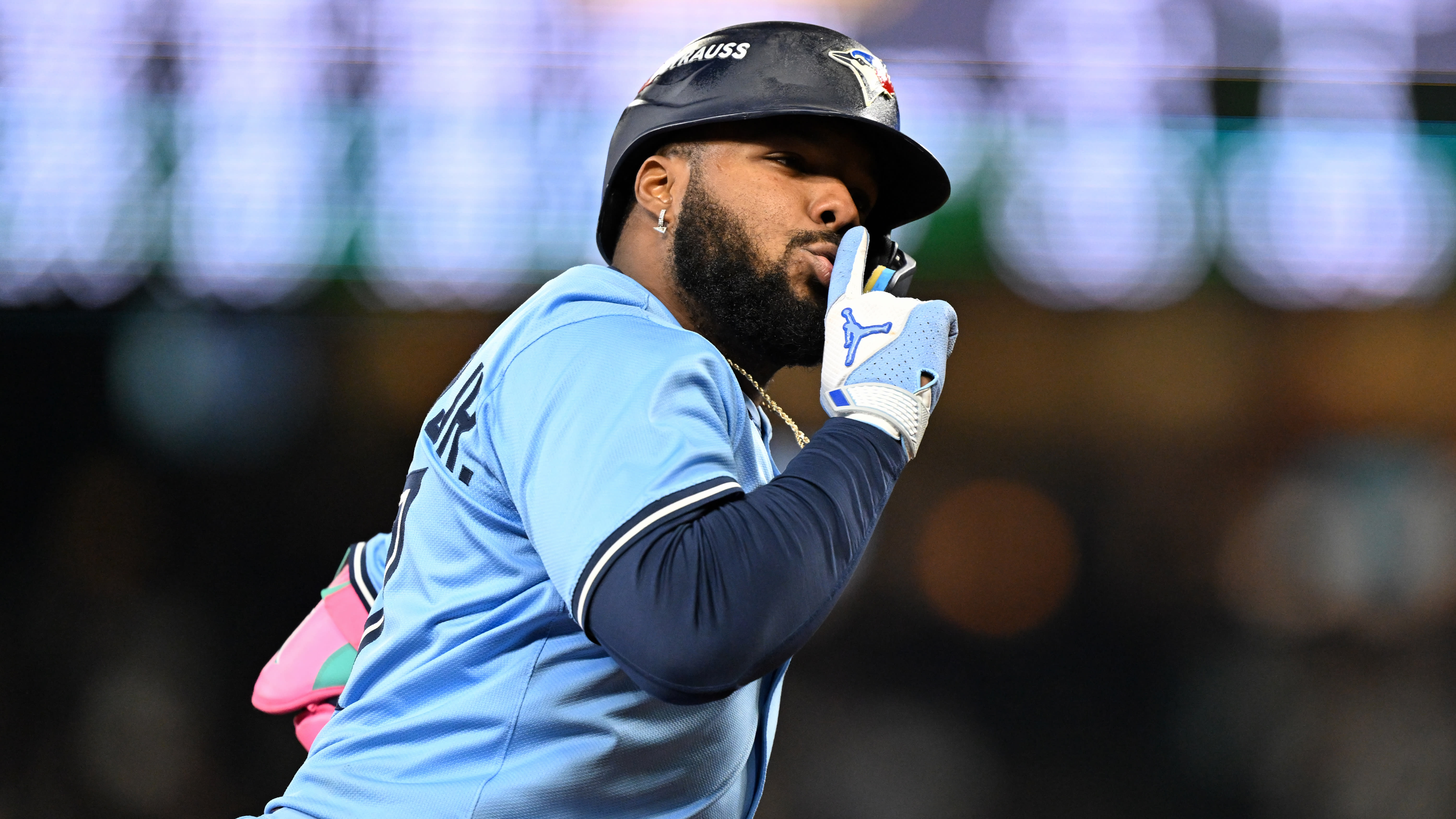Vladimir Guerrero Jr. holds a finger to his lips as he rounds the bases on a home run