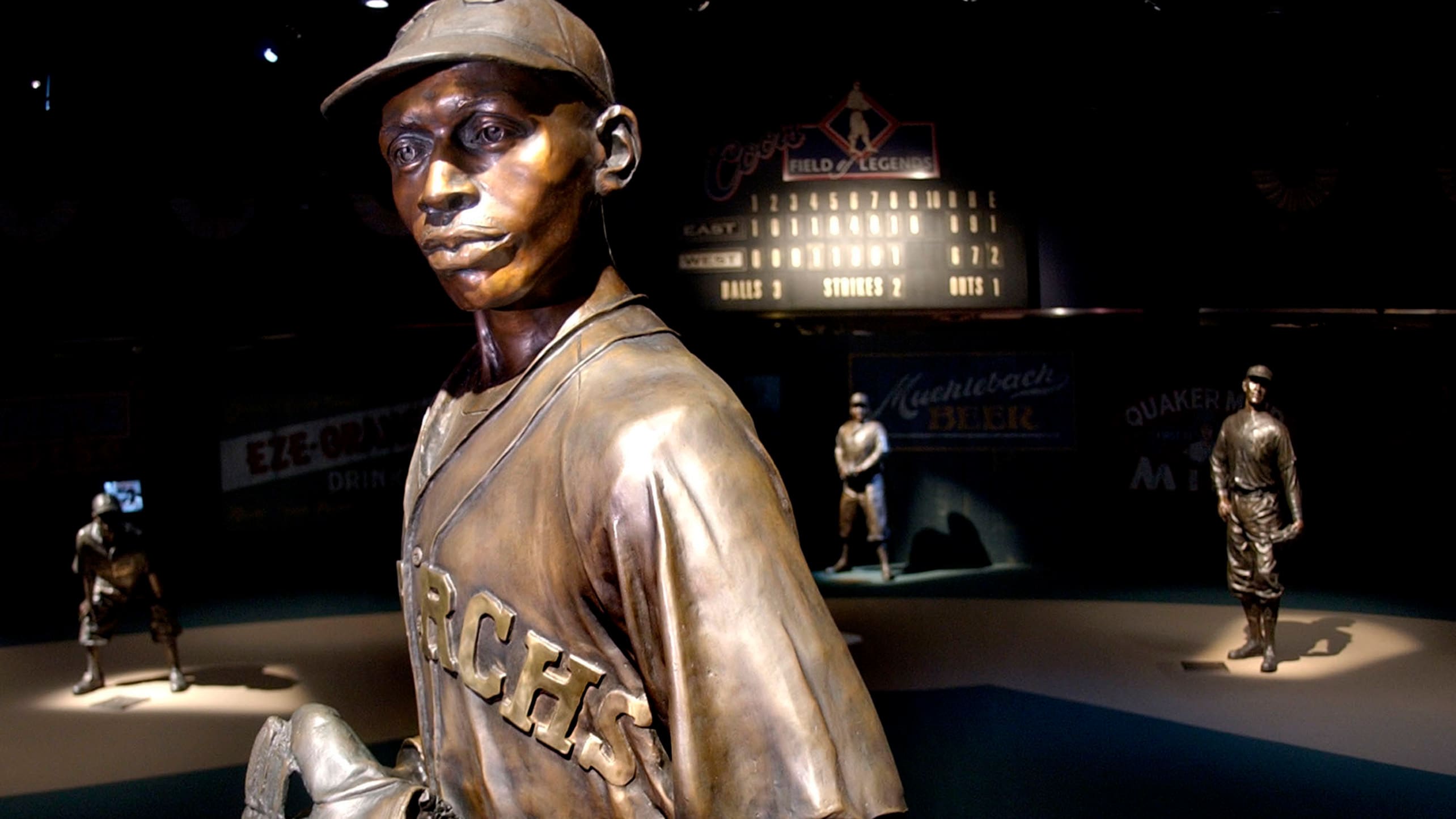 Four statues in the Negro Leagues Baseball Museum's Field of Legends