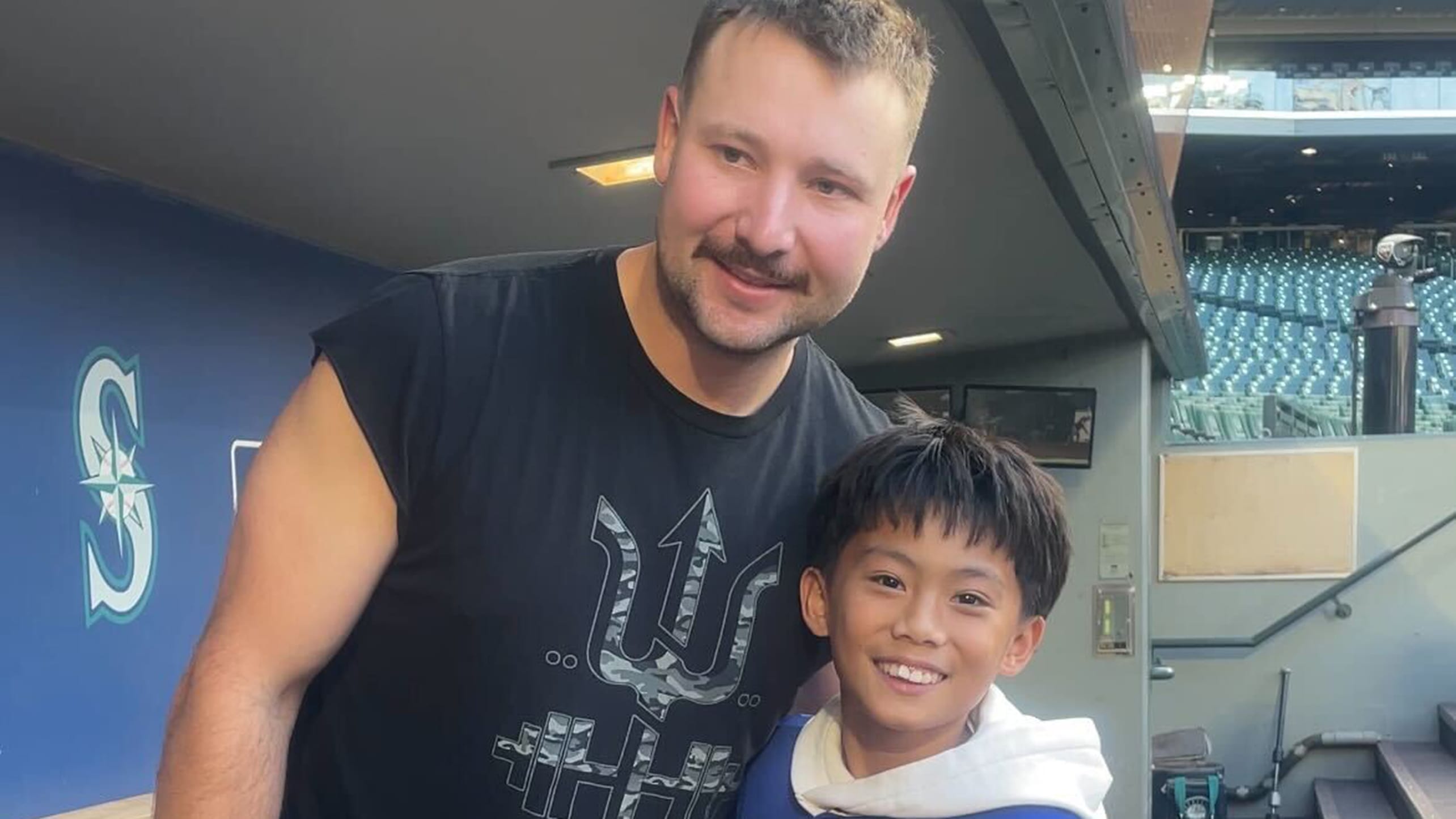 Cal Raleigh and 12-year-old Marcus Ruelos