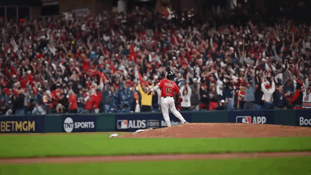 An animated gif of José Ramírez hopping around the bases after hitting a home run