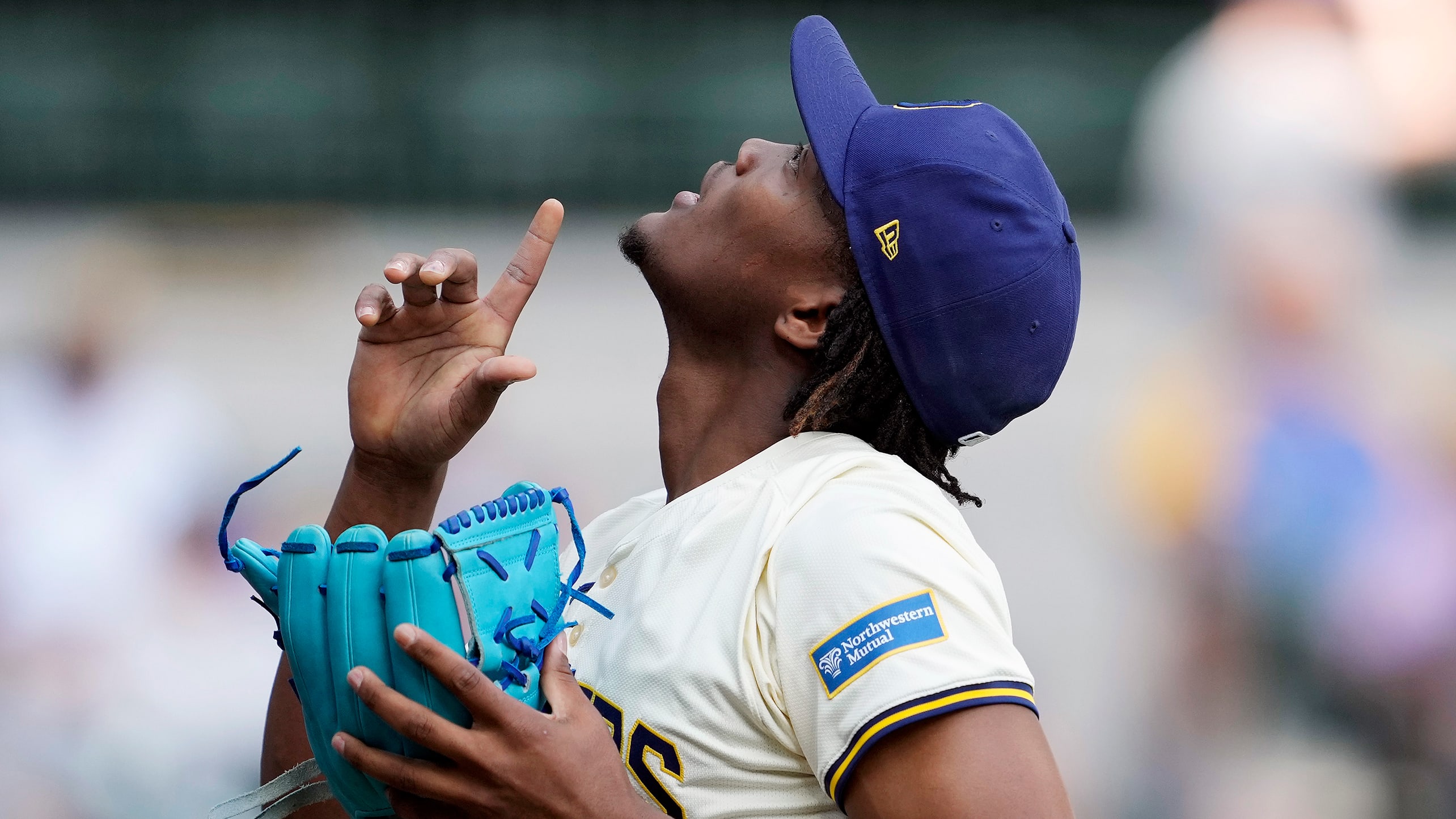 Abner Uribe points to the sky after recording an out