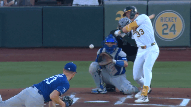 An animated gif of Eric Lauer making a no-look behind-the-back stab of a one-hopper up the middle