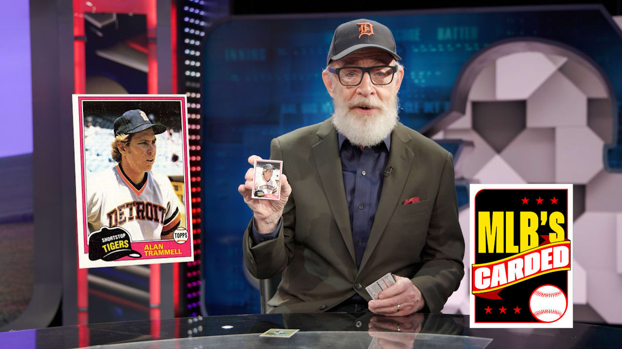Actor J.K. Simmons holds up an Alan Trammell card