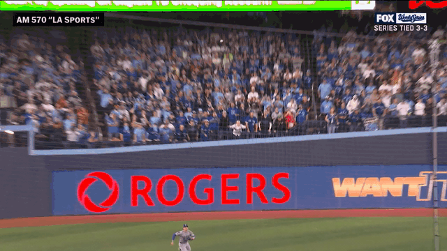 An animated gif of Enrique Hernández making a catch in left field and throwing to second base to complete a double play