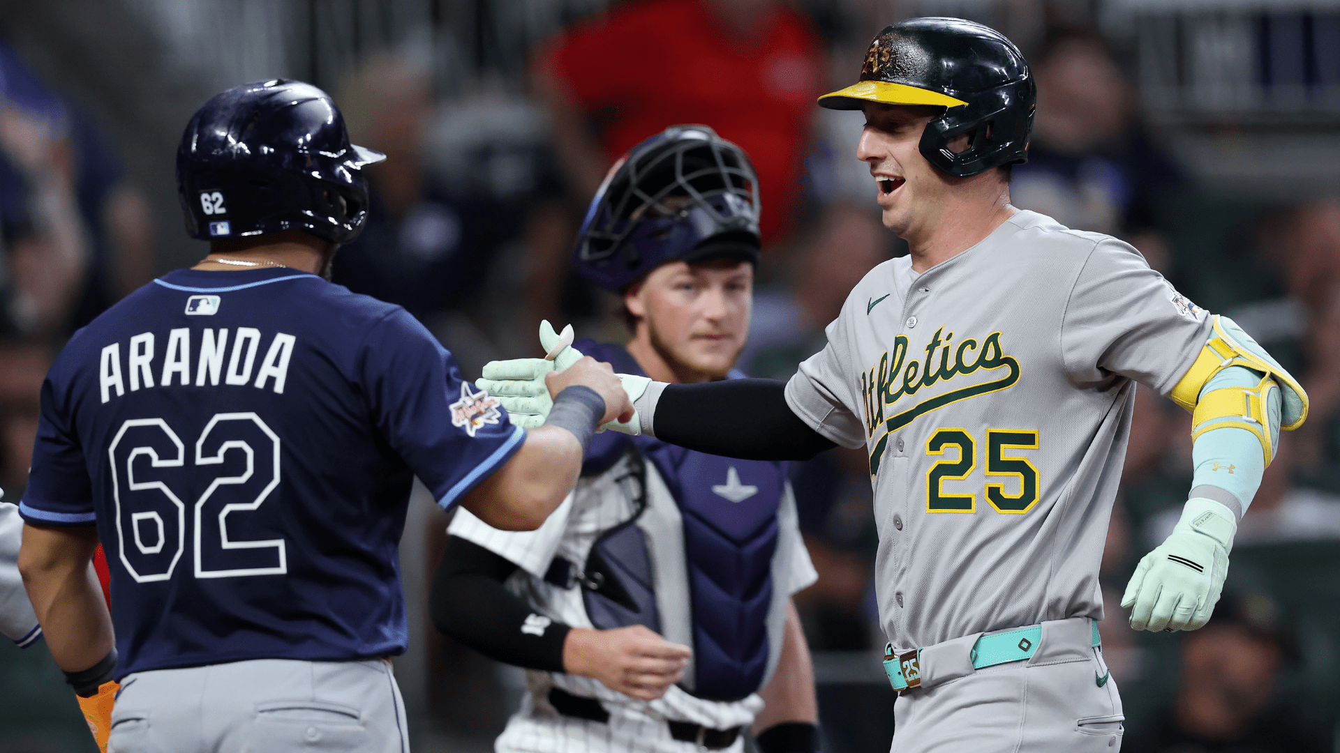 Brent Rooker slaps hands with Jonathan Aranda after hitting a 3-run homer in the 2025 All-Star Game