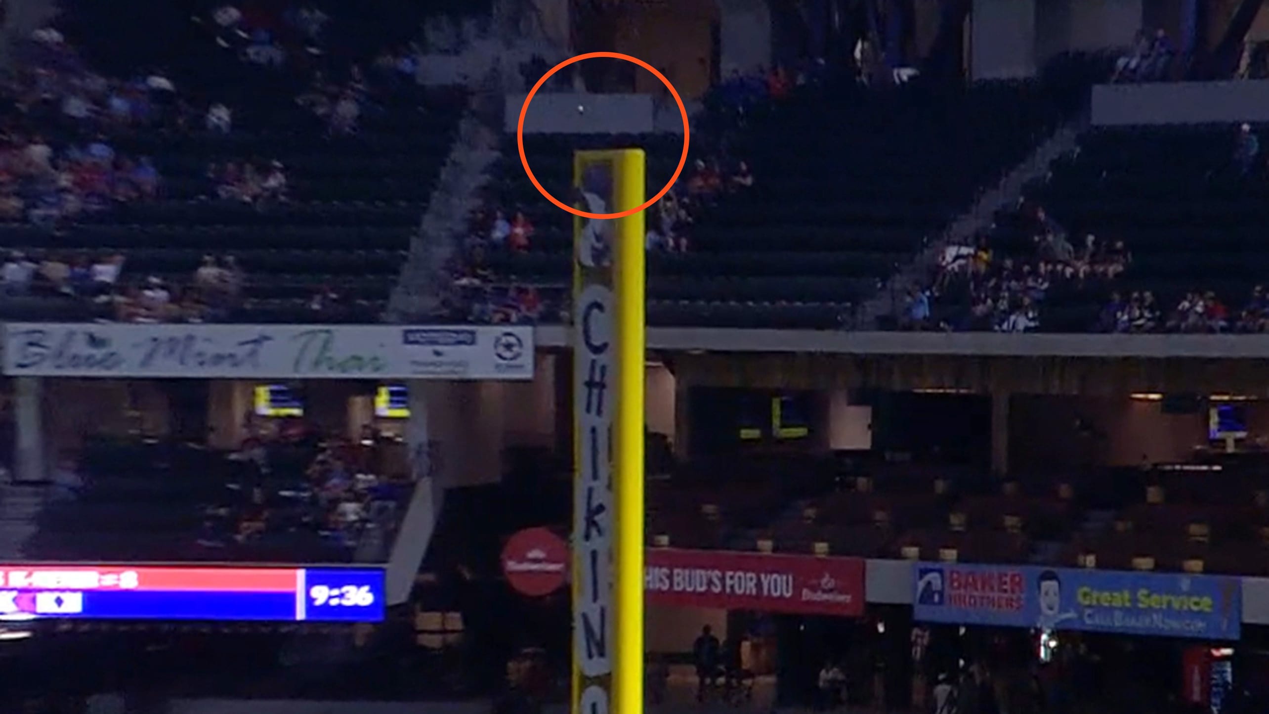 A screenshot of a ball circled above a foul pole