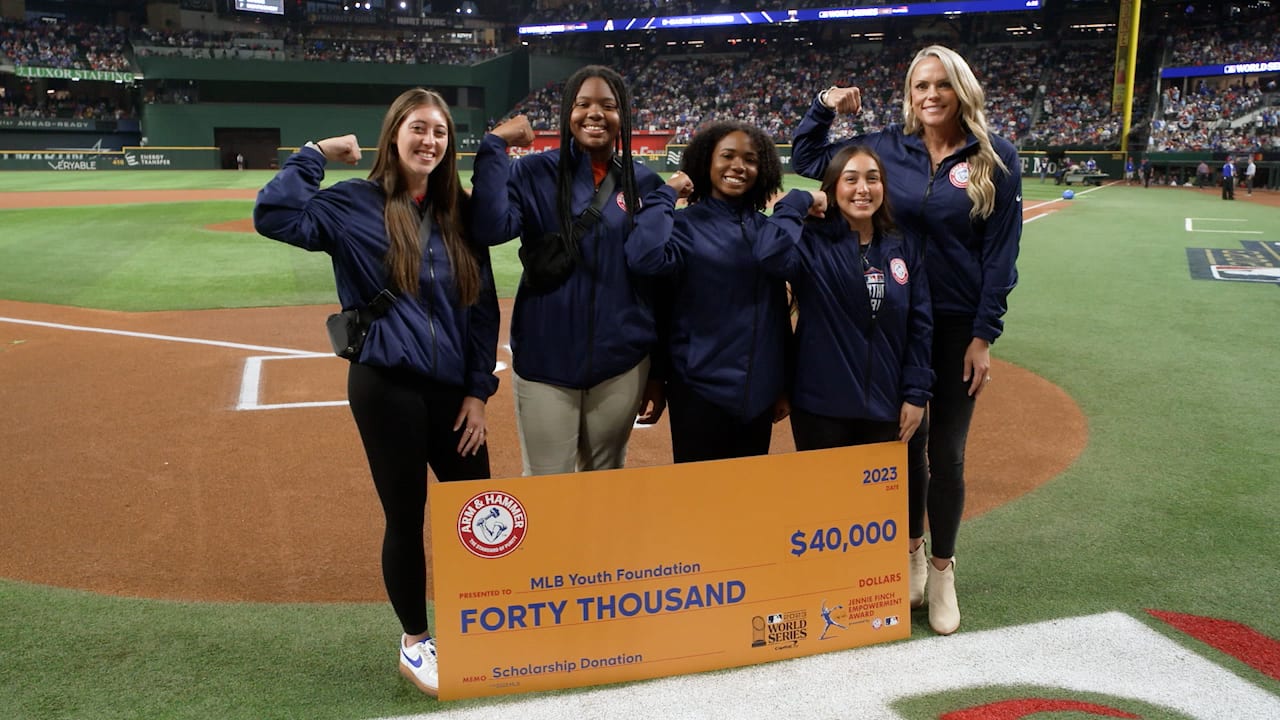 Four softball players with Jennie Finch