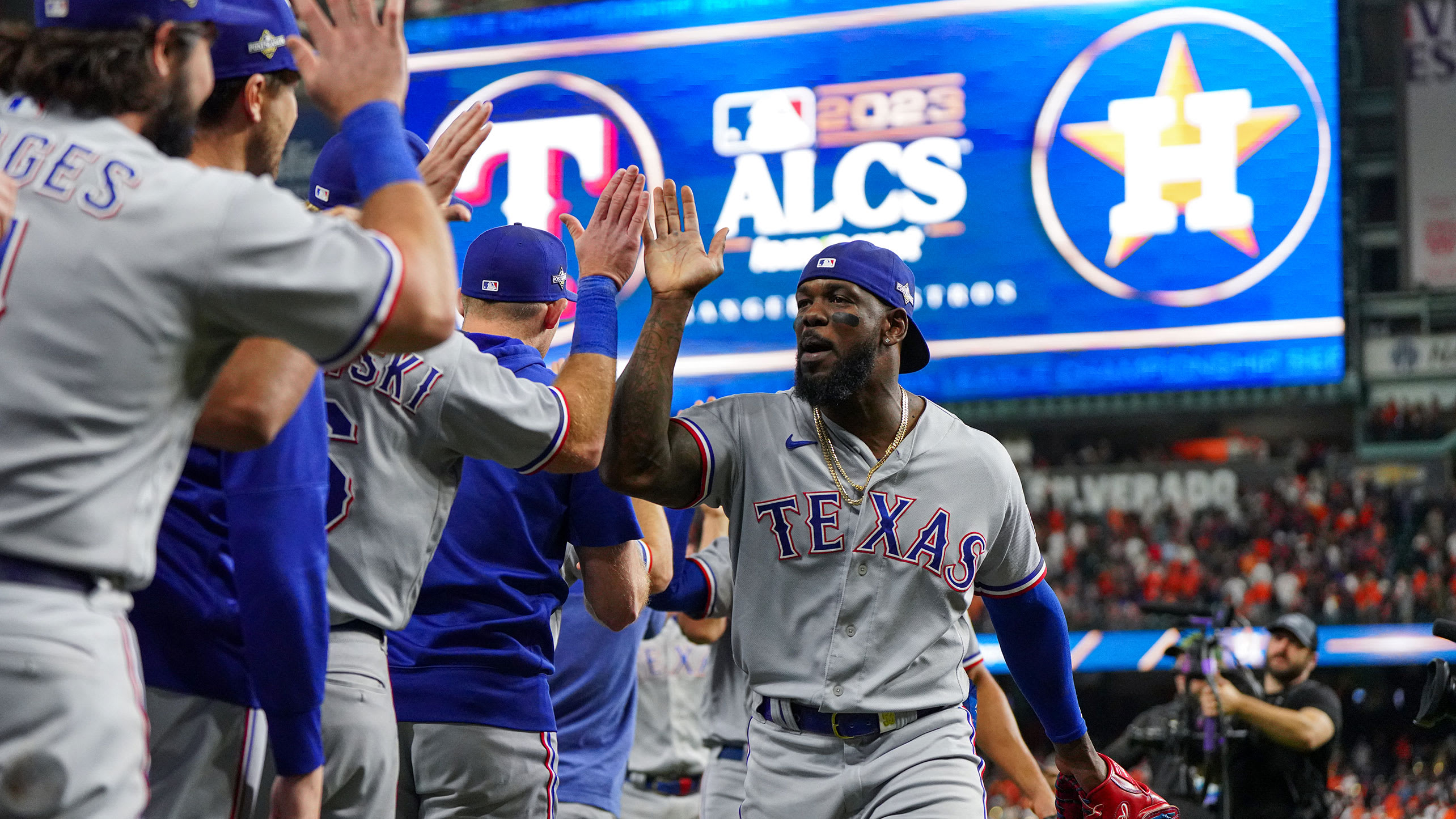 Adolis García and the Rangers celebrate a win in the ALCS