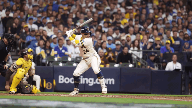 An animated gif of William Contreras hitting a home run and celebrating toward the Brewers' dugout