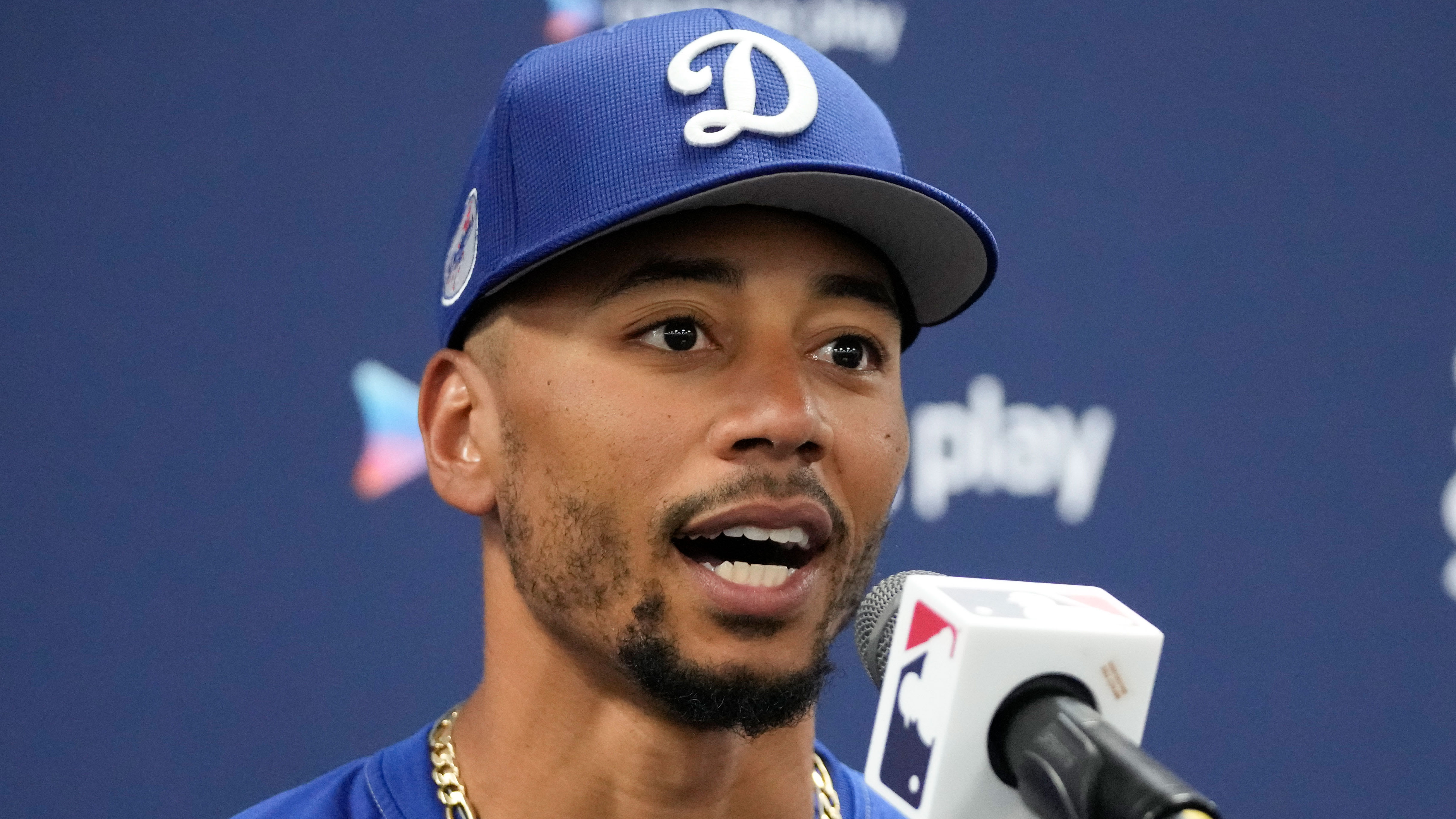 Mookie Betts speaks at a press conference