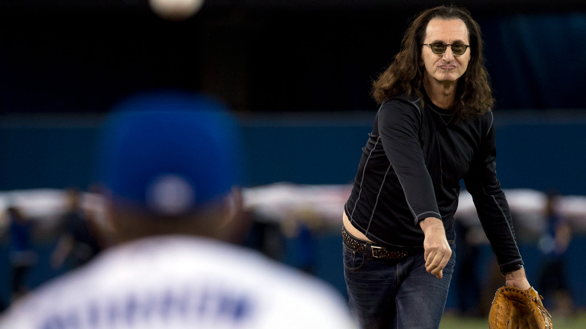 Geddy Lee of the band Rush delivers a pitch