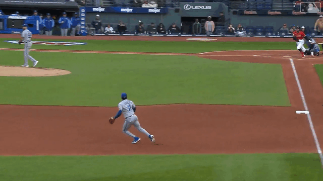 An animated gif of the Royals turning a double play from the third baseman to shortstop to second baseman to first baseman