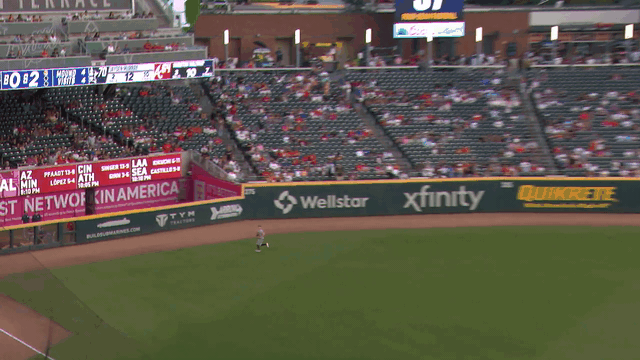 An animated gif of Astros rookie Zach Cole making a leaping catch and slamming into the left-field wall