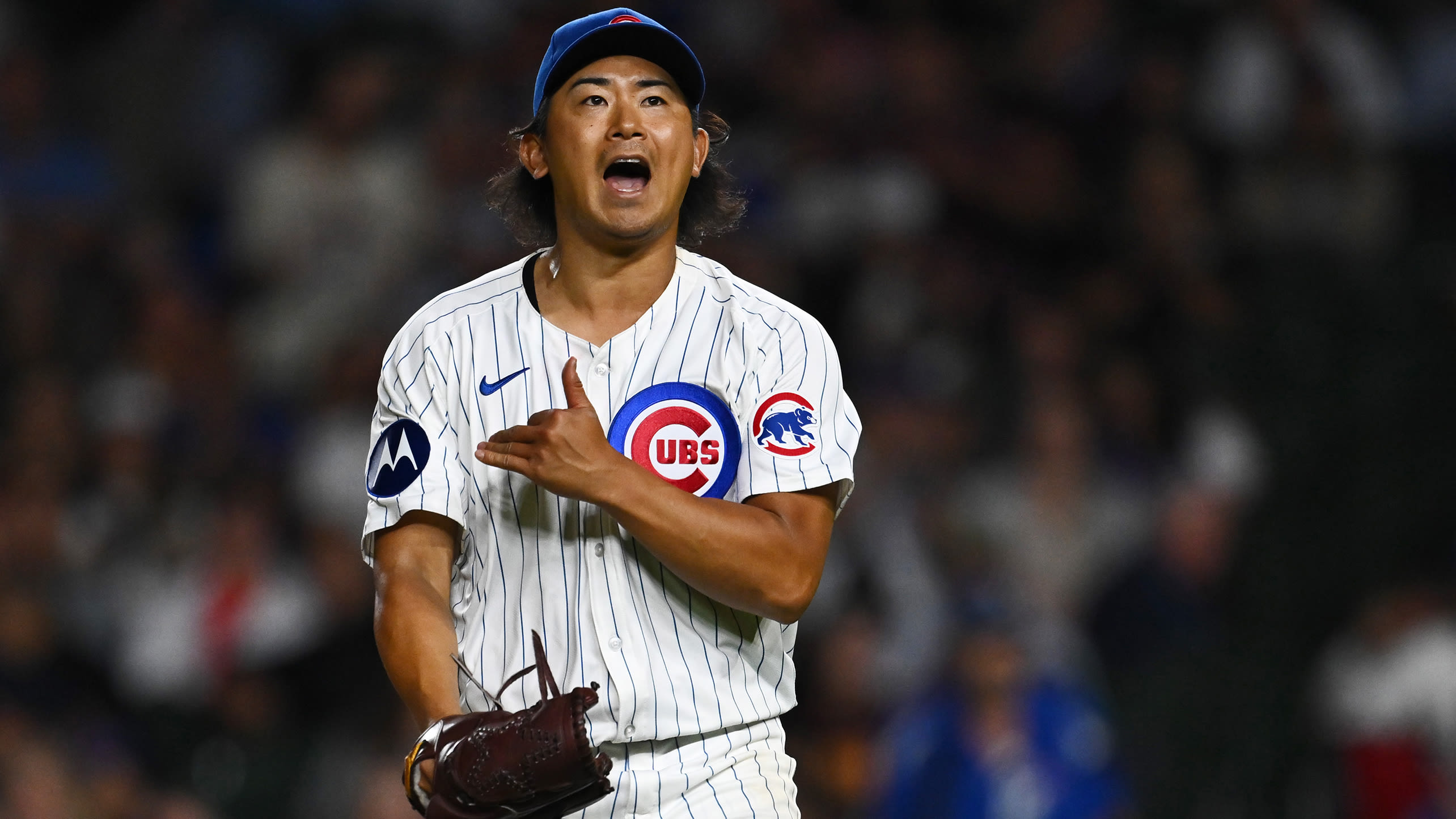 Shota Imanaga reacts with excitement after recording an out during his no-hit outing