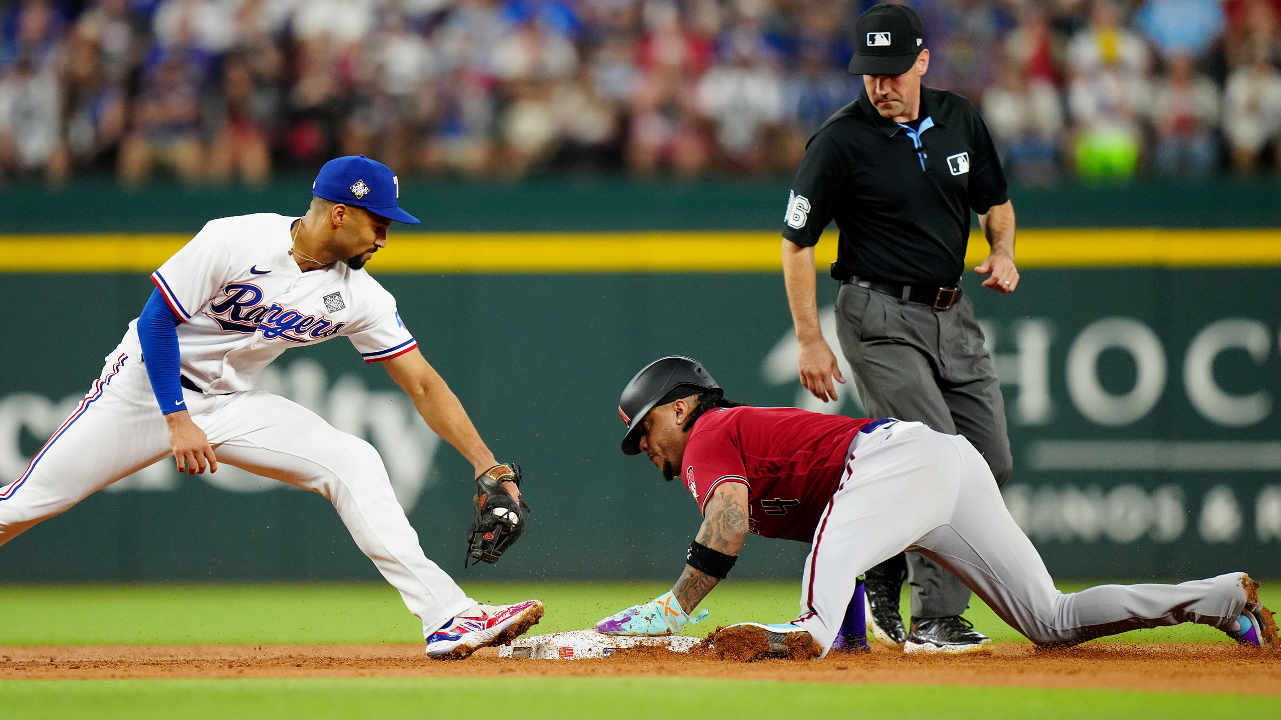 Marcus Semien moves to apply a late tag on Ketel Marte at second base