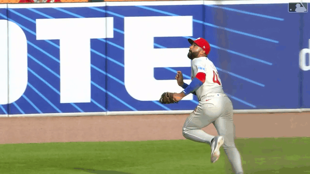 An animated gif of Phillies center fielder Derek Hill making a diving catch