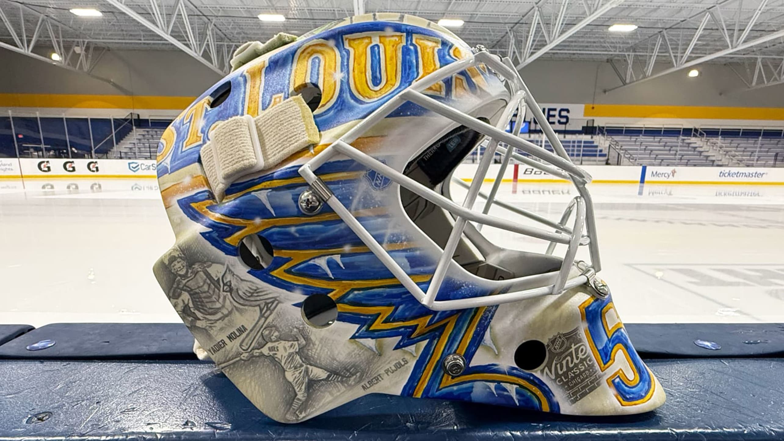 Jordan Binnington's goalie helmet featuring Cardinals players