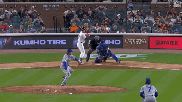 An animated gif of Bobby Witt Jr. diving to just make a catch of a line drive up the middle